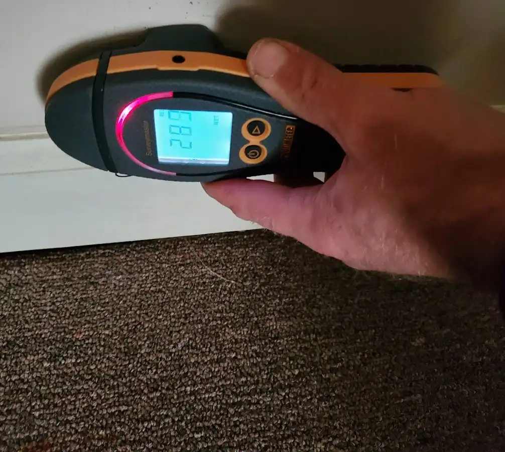 Moisture detection at baseboard during Storm Damage Restoration in Voorhees